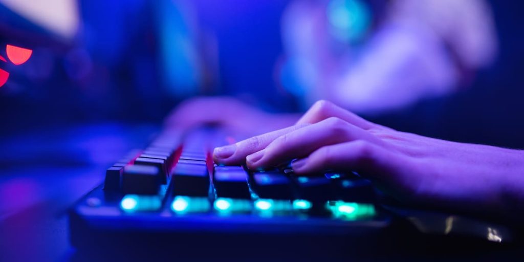 Person typing on a mechanical keyboard.