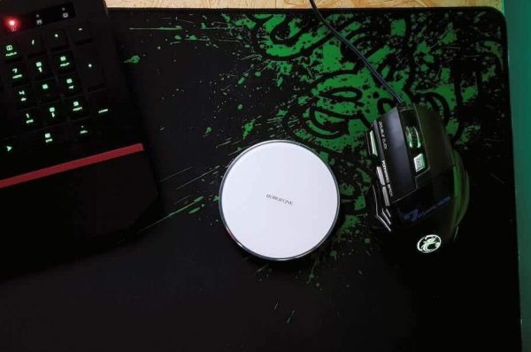 Mouse and keyboard sitting on a mouse pad.