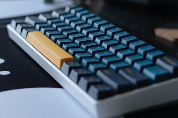 Mechanical keyboard sitting on a desk.